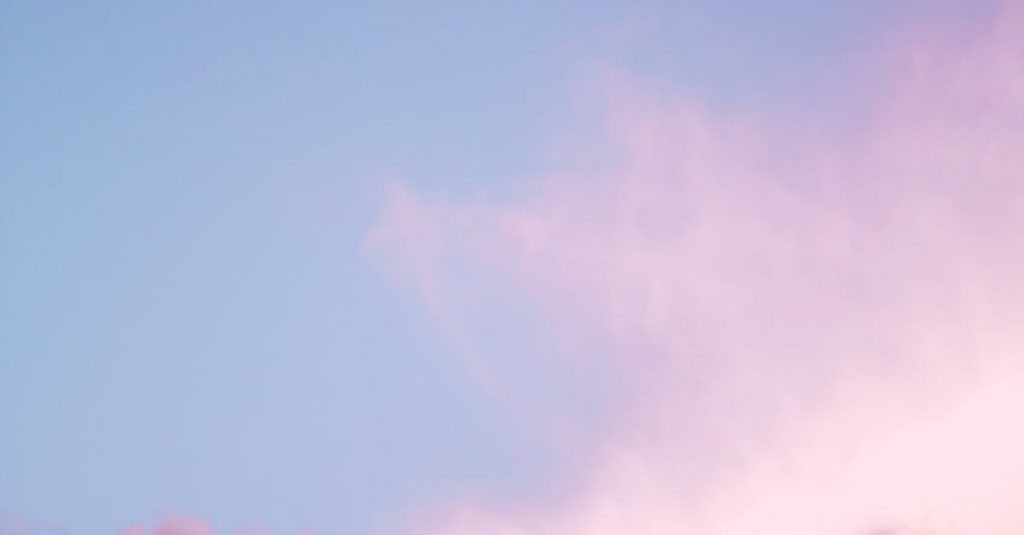 A breathtaking view of a vibrant pink and blue sky with soft clouds in Berlin.
